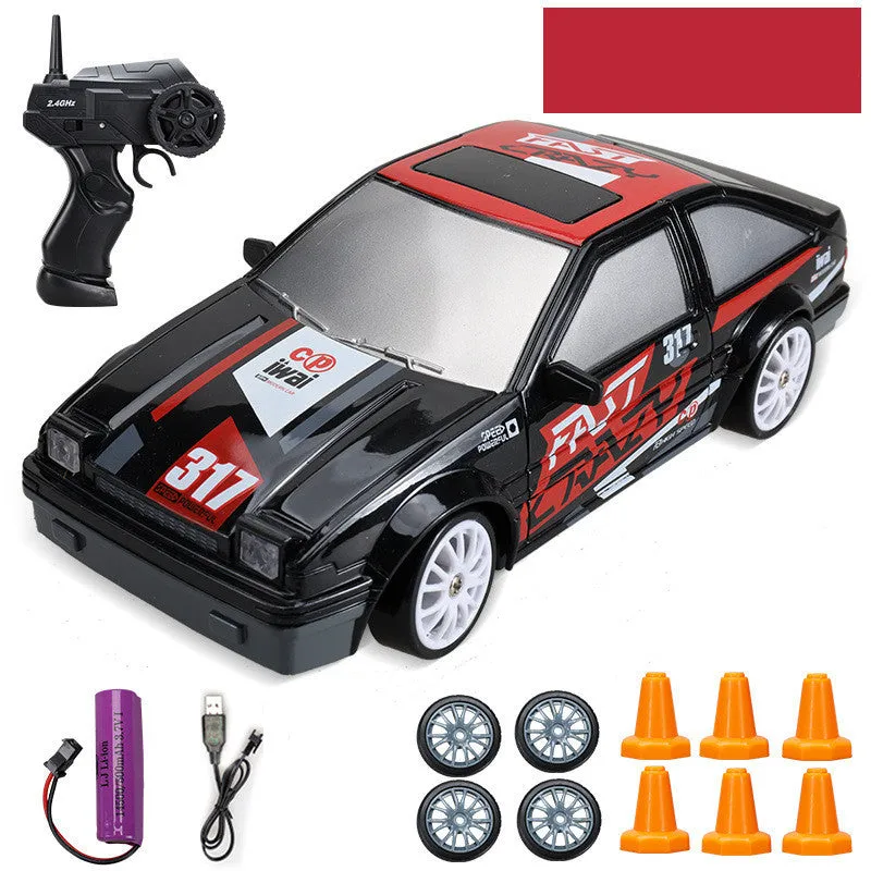 Huangbo red 4WD remote control drift car with wireless controller on a racing track