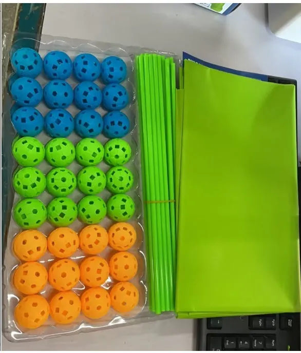 Children's fort building kit showing plastic rods, connector balls, and a constructed play tent frame.
