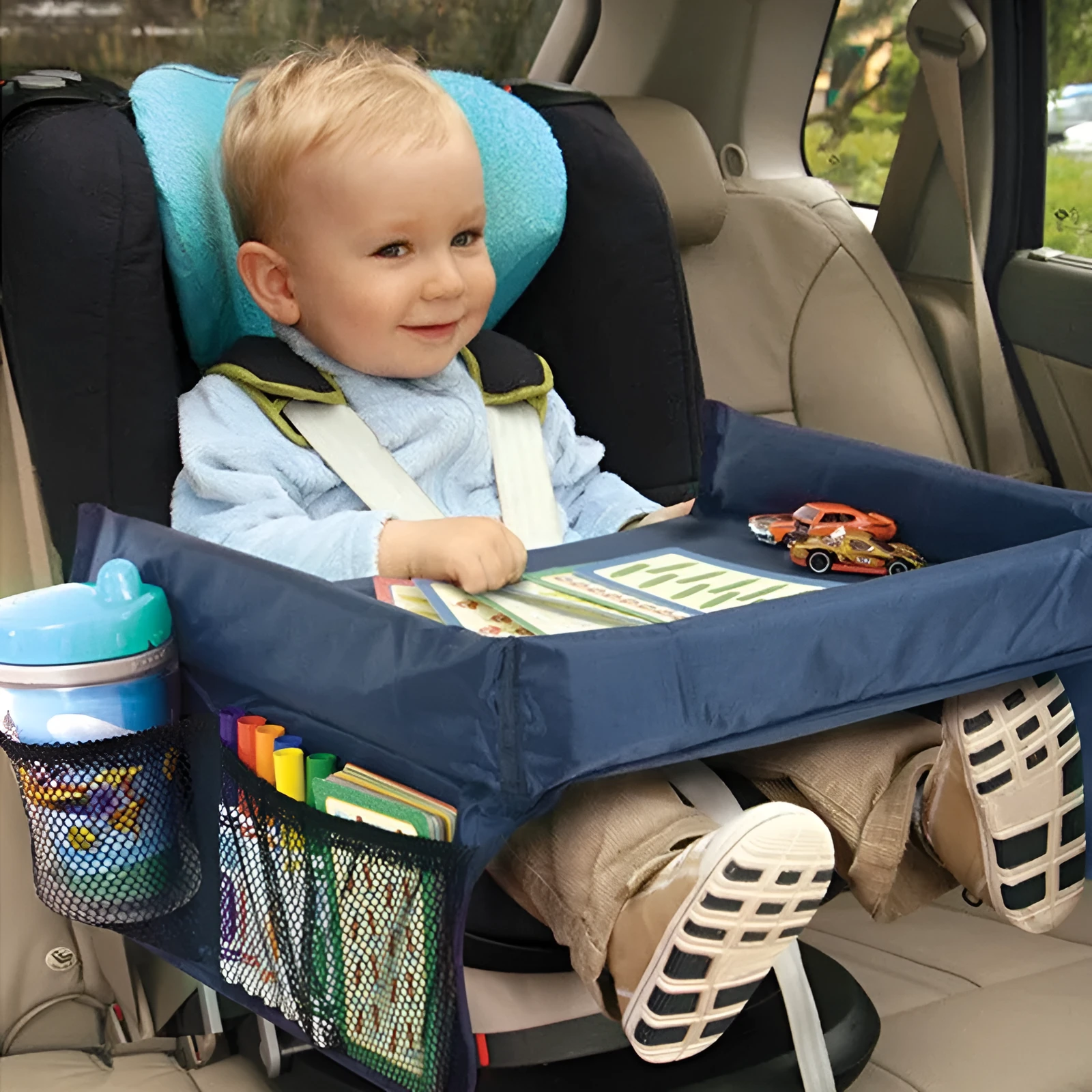 Dark blue waterproof polyester tray for children's toys on a car seat.