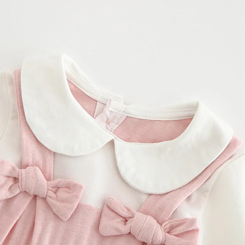Pink cotton baby girl's long sleeve jumpsuit with single-breasted closure
