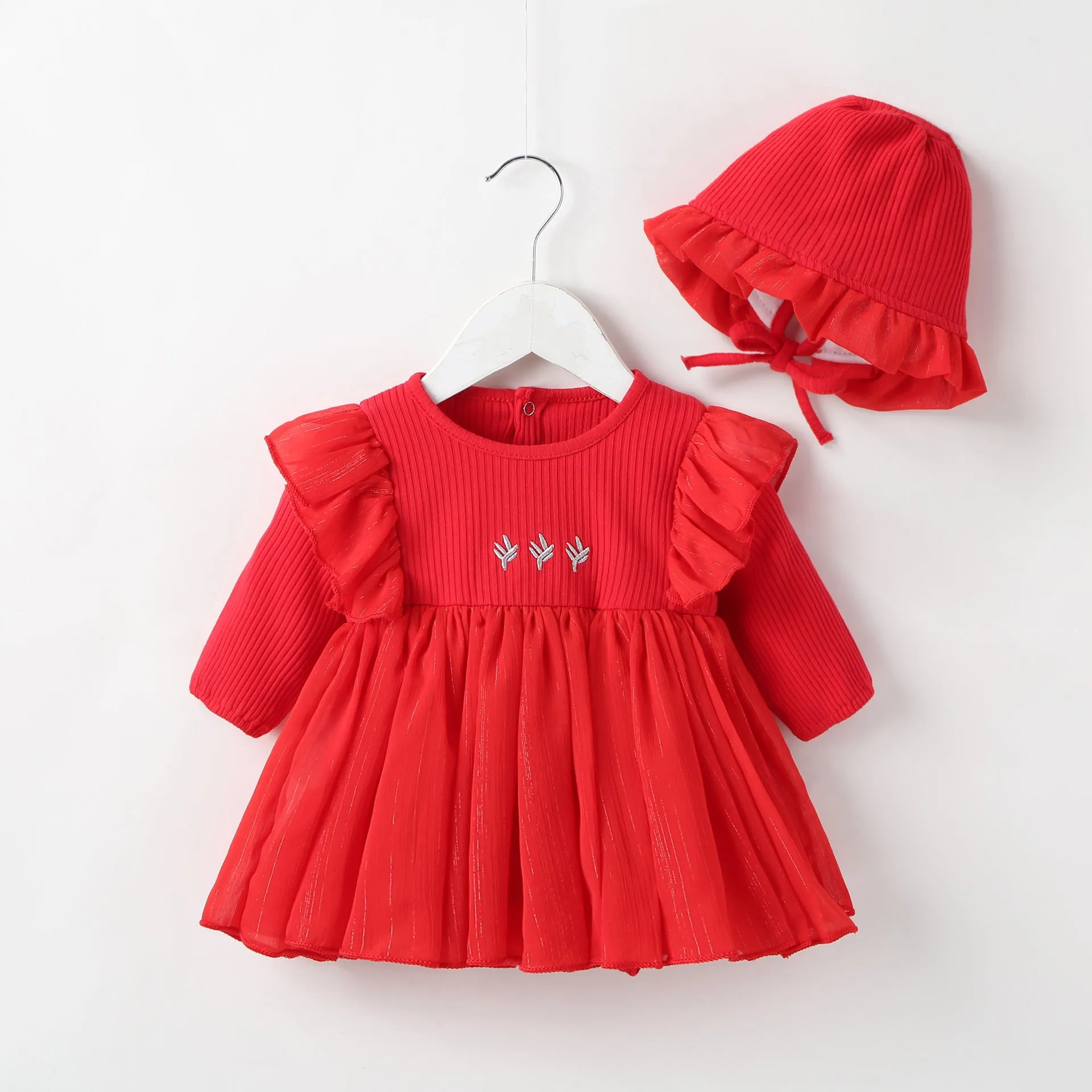 Soft cotton fluffy baby princess dress in pink, shown on a hanger.