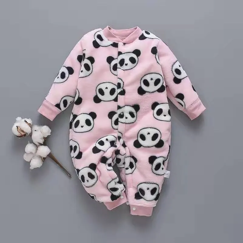 Baby wearing a long-sleeved flannel romper in a pink bunny head print, showcasing the 100% cotton fabric.