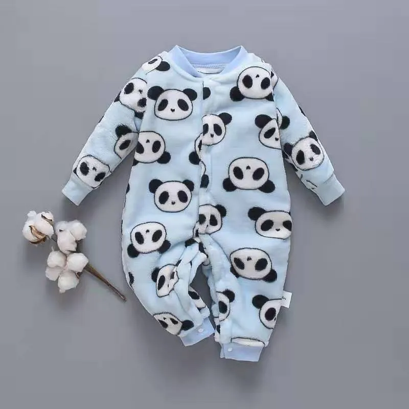 Baby wearing a long-sleeved flannel romper in a pink bunny head print, showcasing the 100% cotton fabric.
