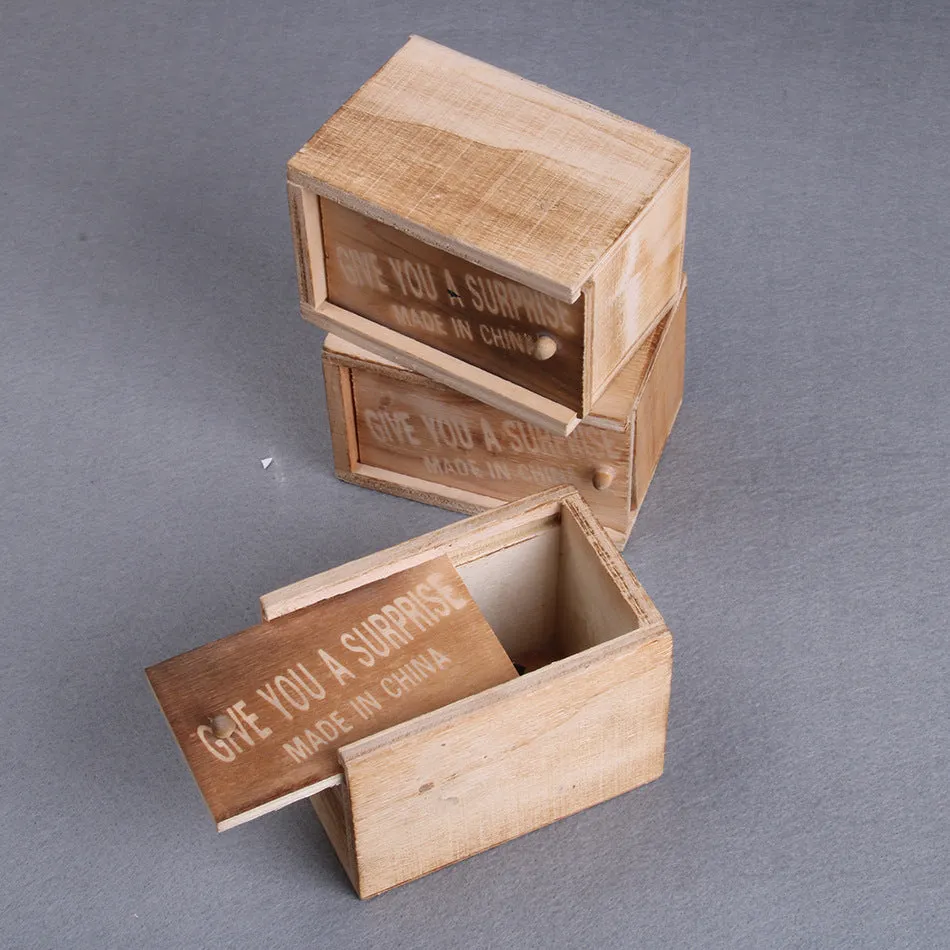 A closed wooden prank scare box measuring 9.1 cm, with a random lifelike animal inside ready to jump out.