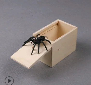 A closed wooden prank scare box measuring 9.1 cm, with a random lifelike animal inside ready to jump out.