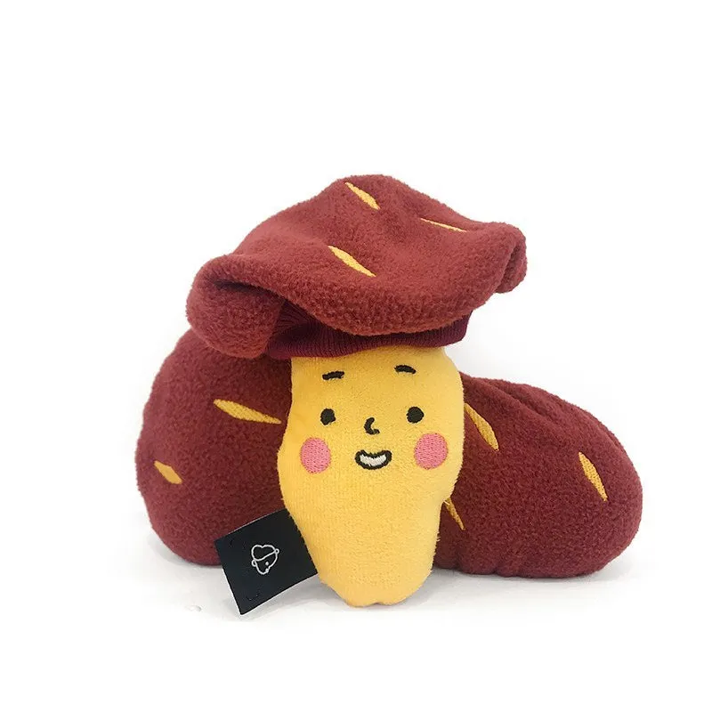 Red sweet potato-shaped dog puzzle toy with peel-open design revealing hidden treat compartments