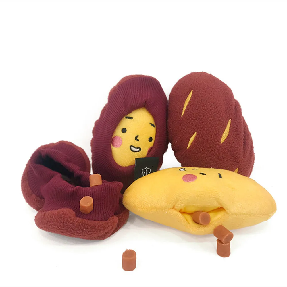 Red sweet potato-shaped dog puzzle toy with peel-open design revealing hidden treat compartments