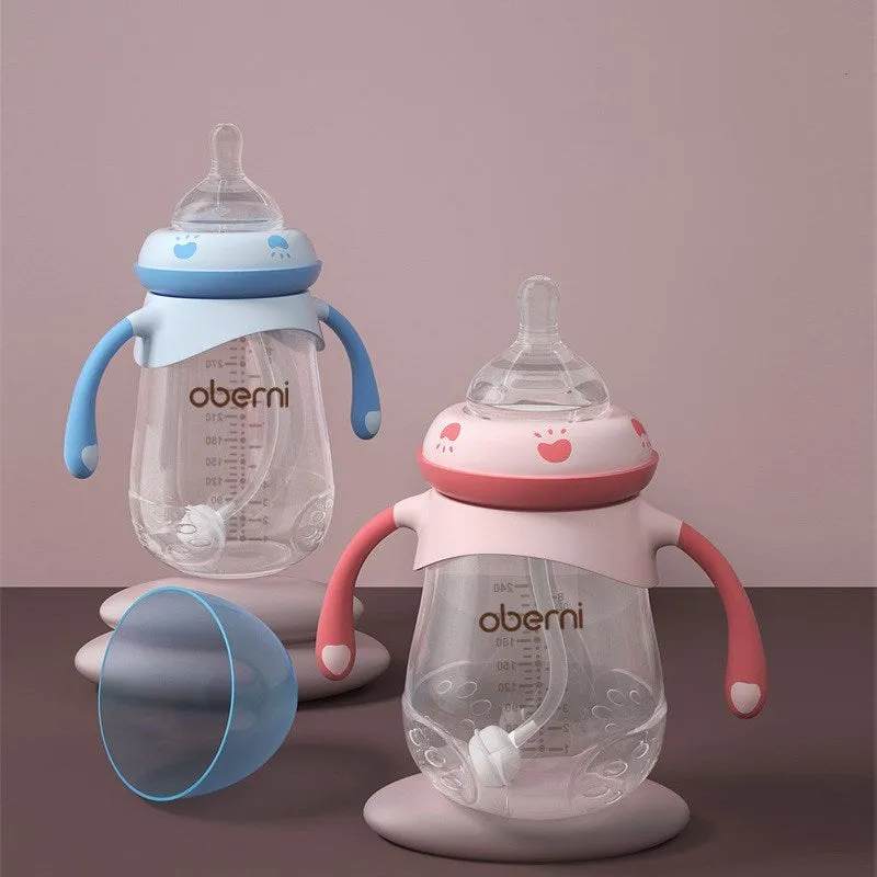 Wide caliber baby feeding bottle with anti-colic valve and handle in blue, green or red colours