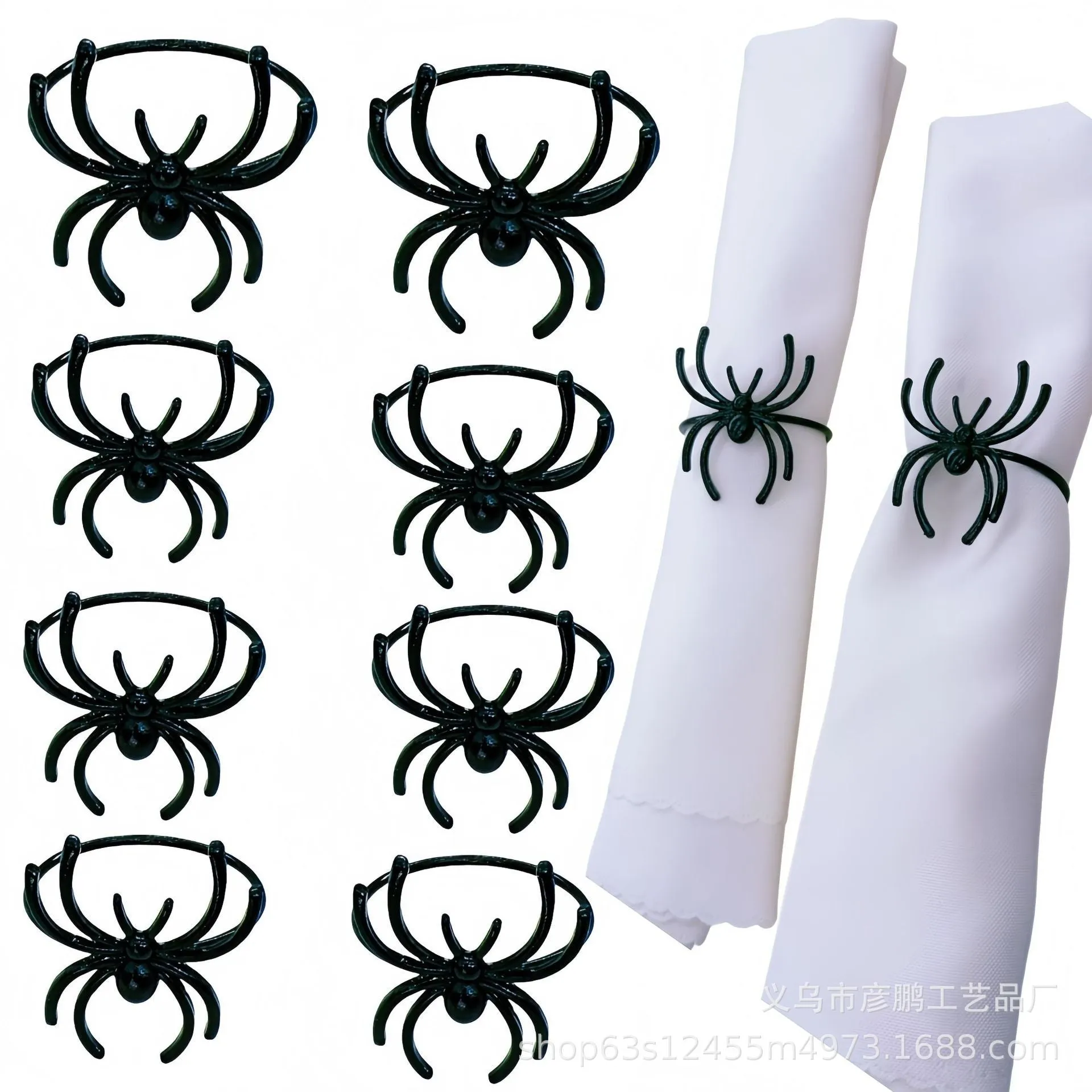 Set of six black alloy spider-shaped napkin rings on a dark tablecloth.