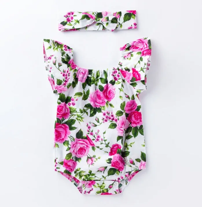 White baby girl's sleeveless cotton romper with small flying sleeves on a hanger.