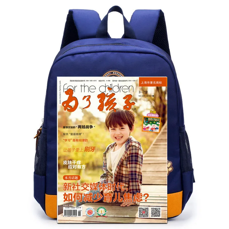 Blue nursery backpack with a cartoon bear design, showing front zip pocket and adjustable padded straps.