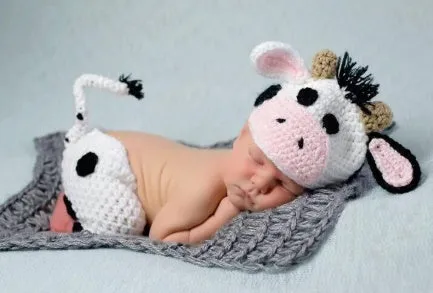 Hand-knitted white newborn cow suit with matching hat and pants for 0-3 month infants