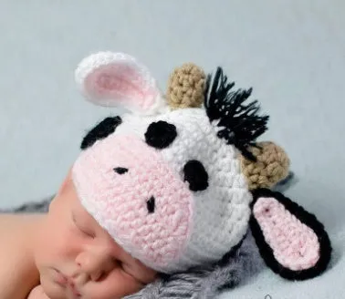 Hand-knitted white newborn cow suit with matching hat and pants for 0-3 month infants