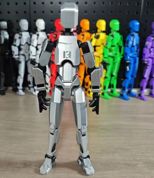 Unassembled 3D printed robot model kit with multi-jointed parts on a table
