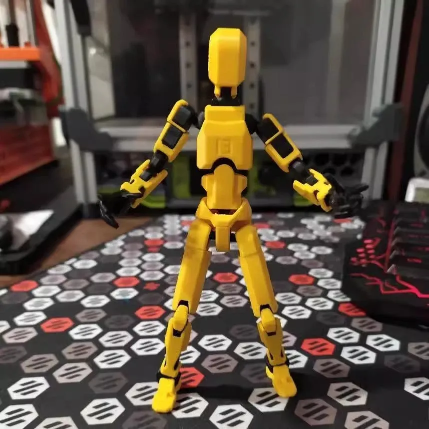 Unassembled 3D printed robot model kit with multi-jointed parts on a table
