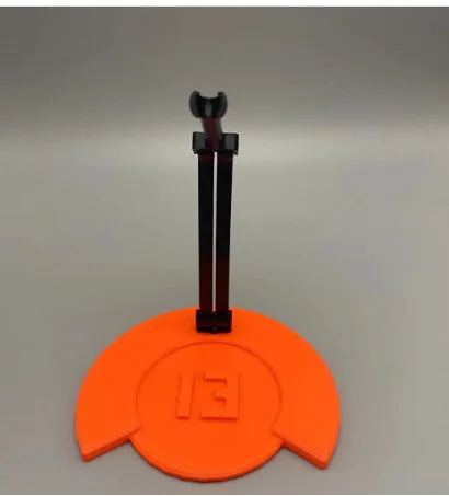 Unassembled 3D printed robot model kit with multi-jointed parts on a table