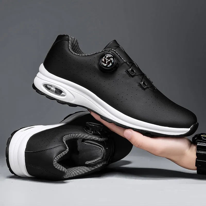 Pair of black low-top mesh tennis shoes with cross shoulder straps and white laces.