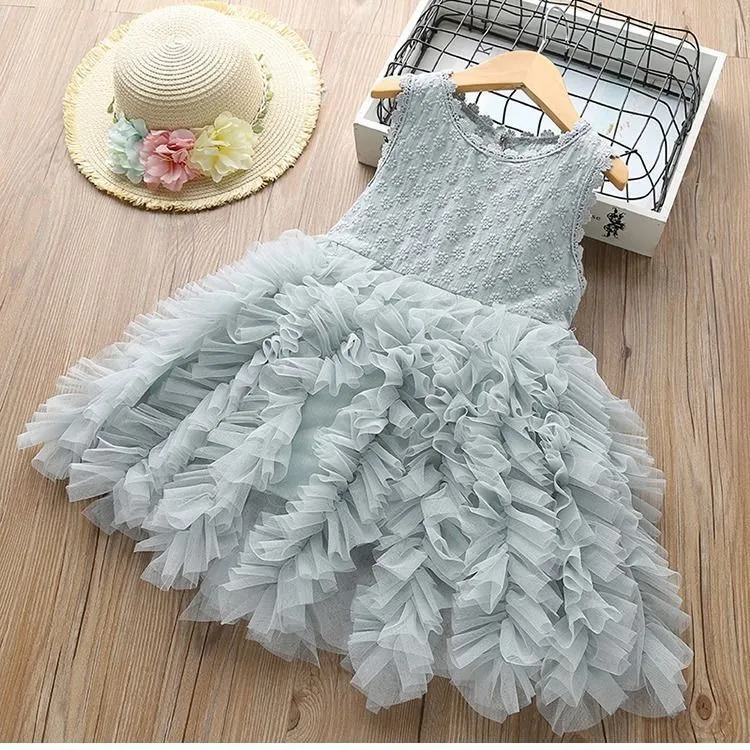 White long-sleeved lace princess dress for girls with an irregular hemline, shown on a hanger.