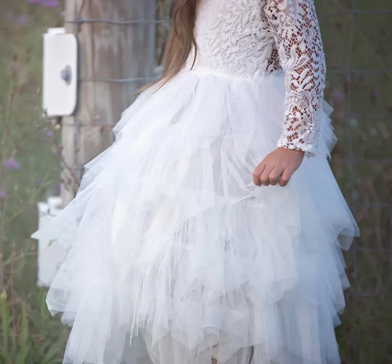 White long-sleeved lace princess dress for girls with an irregular hemline, shown on a hanger.