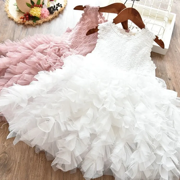 White long-sleeved lace princess dress for girls with an irregular hemline, shown on a hanger.
