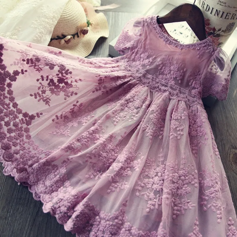 White long-sleeved lace princess dress for girls with an irregular hemline, shown on a hanger.