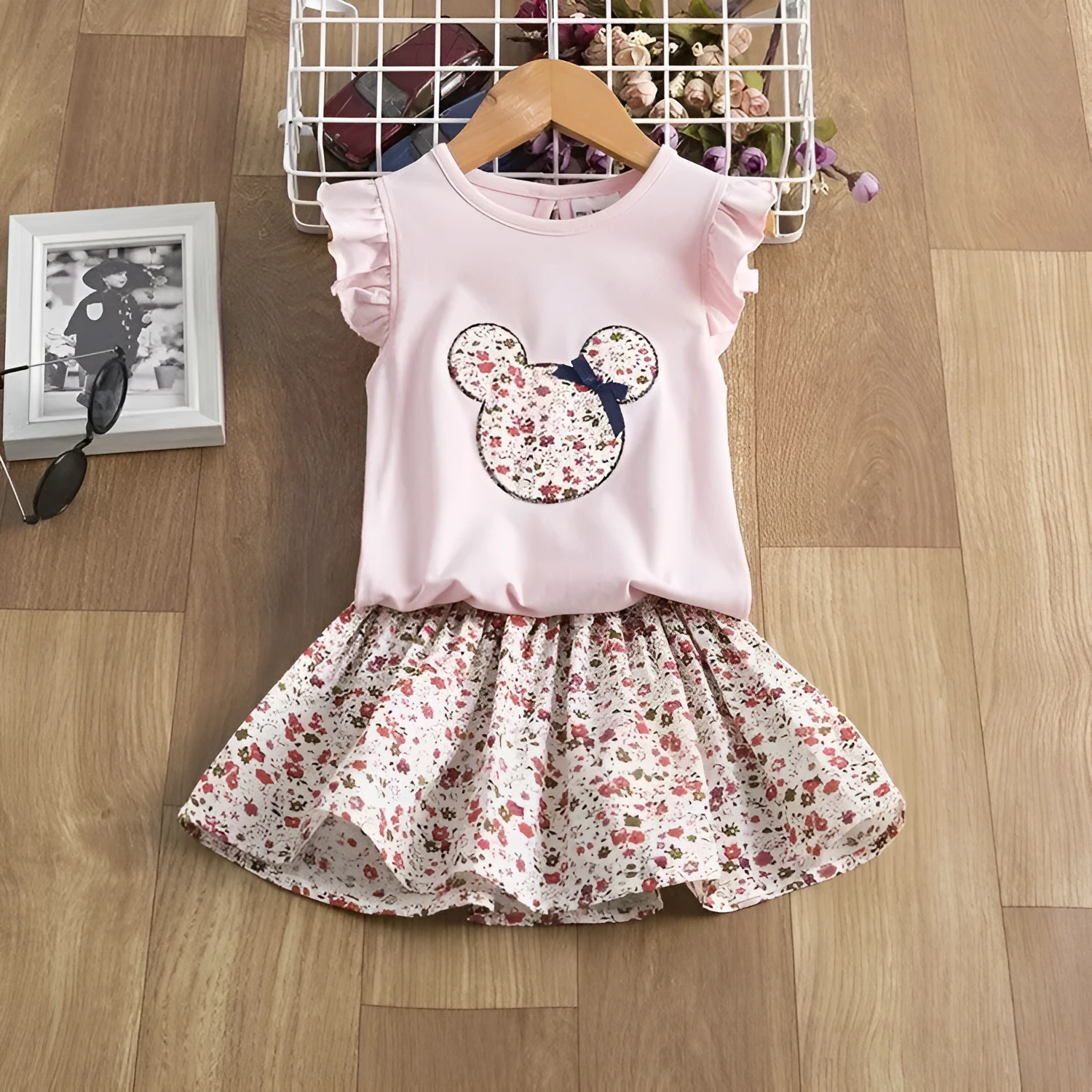 A girls' polyester playsuit outfit for summer in black, pink, or white, available in sizes 2T to 6T.