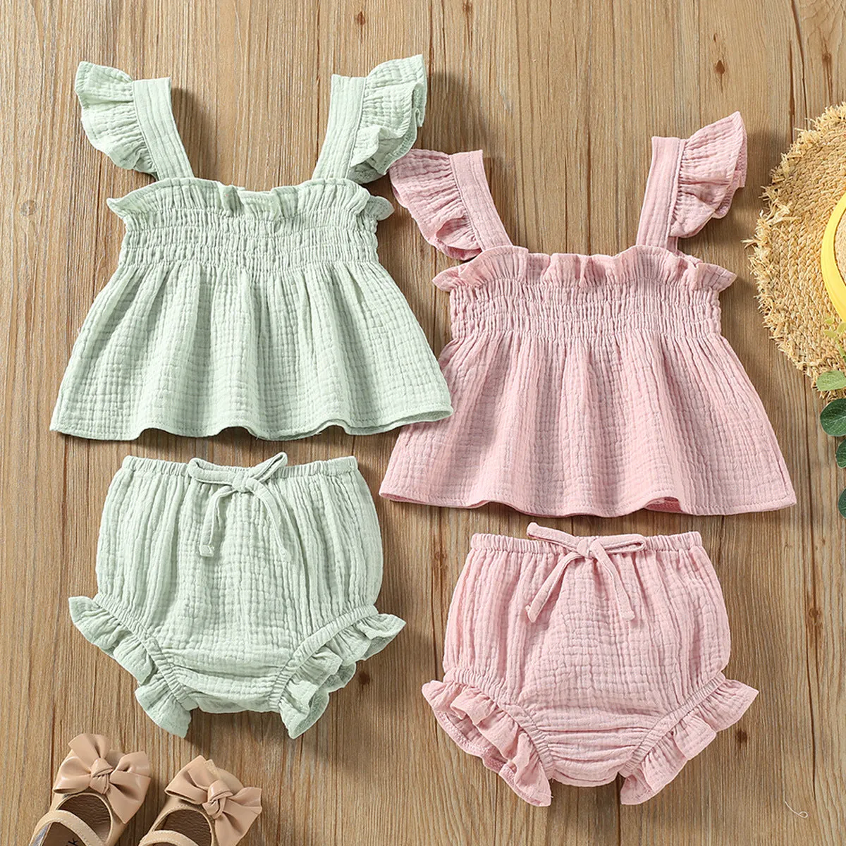 Girls' green cotton two-piece set with sleeveless top and short hot pants.