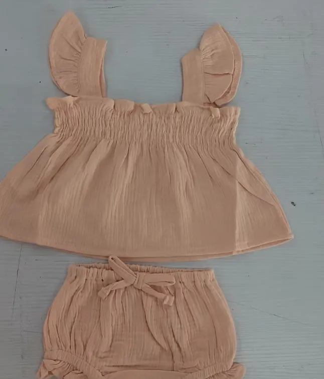 Girls' green cotton two-piece set with sleeveless top and short hot pants.