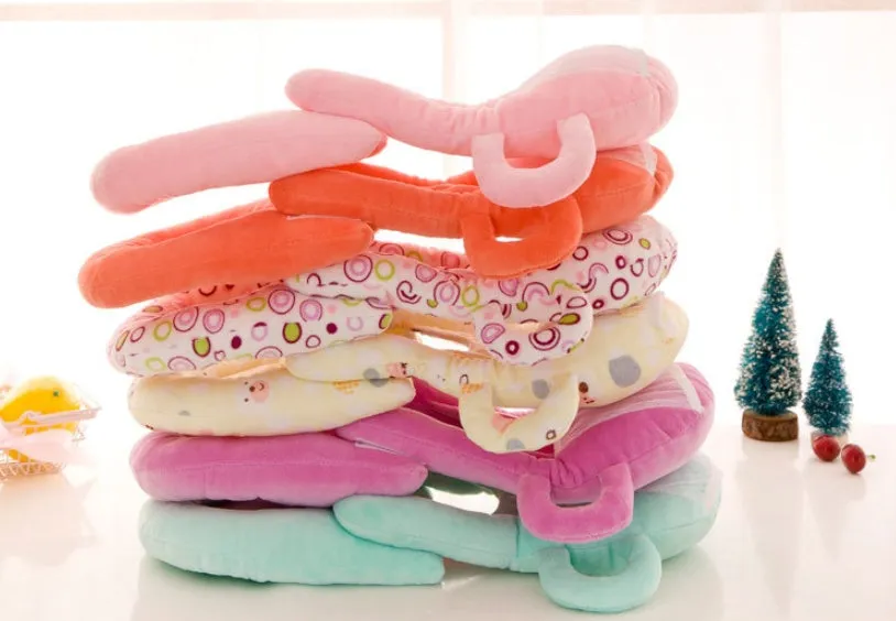 Super soft short plush baby feeding pillow measuring 30cm by 42cm in pink colour