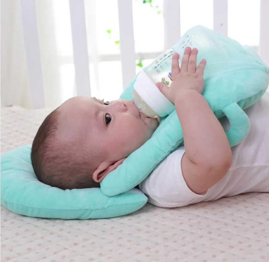 Super soft short plush baby feeding pillow measuring 30cm by 42cm in pink colour