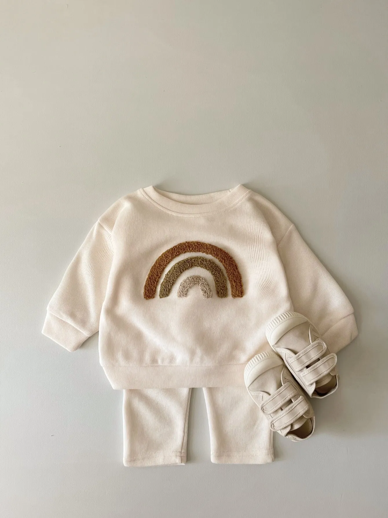 Creamy-white baby cotton two-piece suit with alphabet embroidery on long sleeve blouse and matching trousers