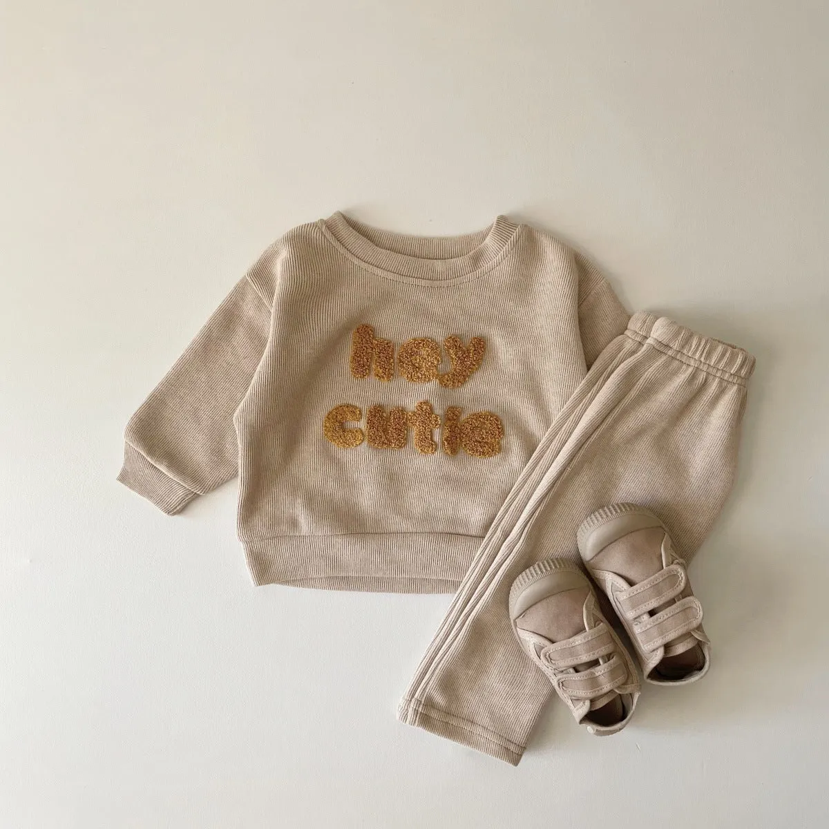 Creamy-white baby cotton two-piece suit with alphabet embroidery on long sleeve blouse and matching trousers