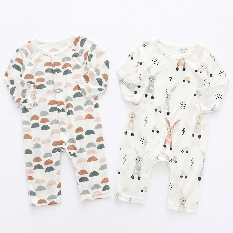 Baby wearing a soft bamboo fibre jumpsuit with a cute Nordic animal print, long sleeves.