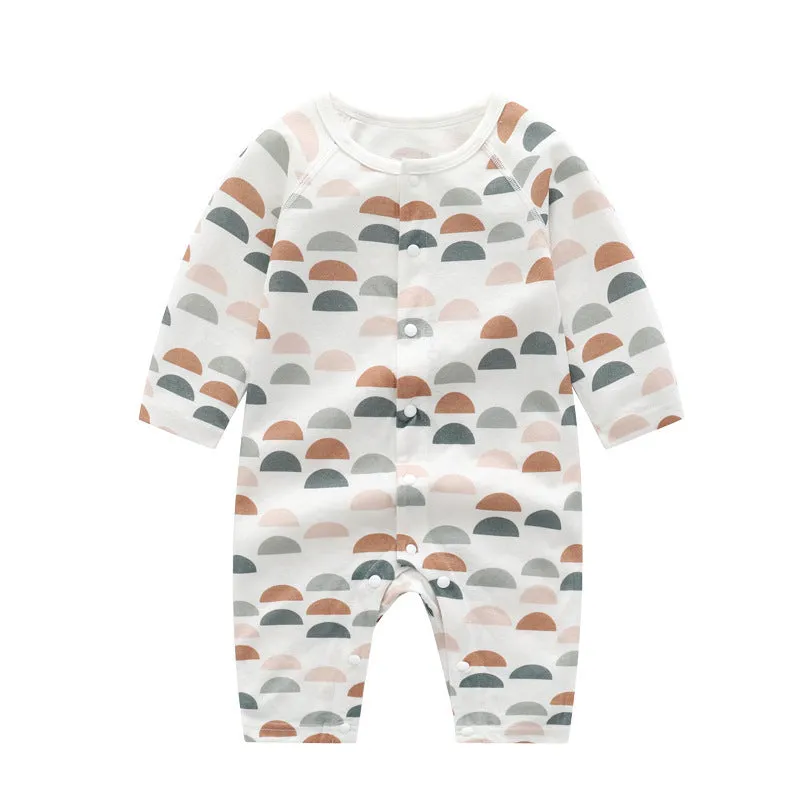 Baby wearing a soft bamboo fibre jumpsuit with a cute Nordic animal print, long sleeves.