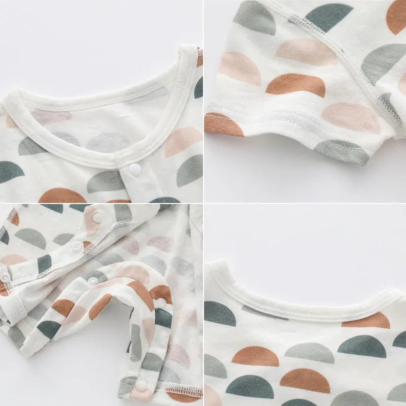 Baby wearing a soft bamboo fibre jumpsuit with a cute Nordic animal print, long sleeves.