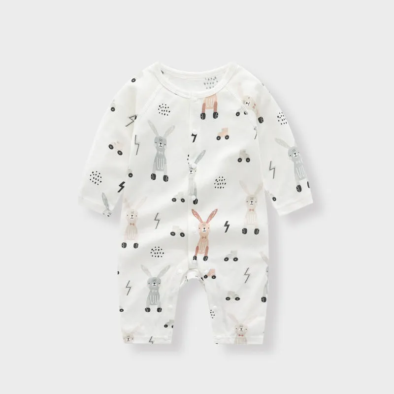 Baby wearing a soft bamboo fibre jumpsuit with a cute Nordic animal print, long sleeves.