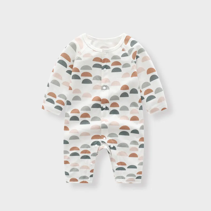 Baby wearing a soft bamboo fibre jumpsuit with a cute Nordic animal print, long sleeves.