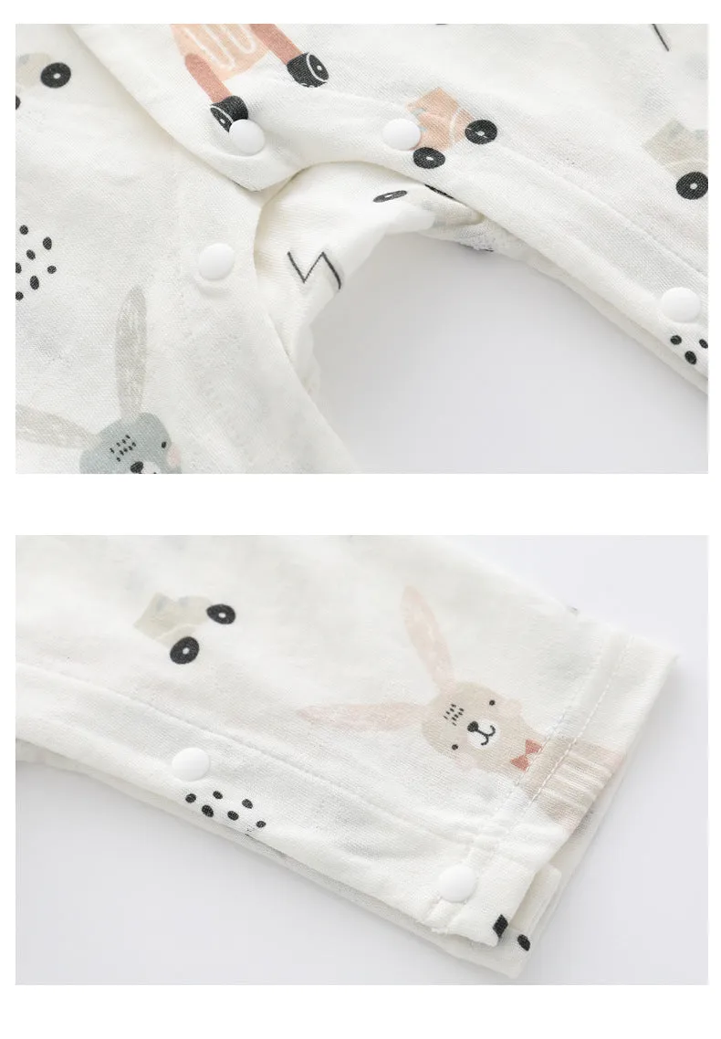 Baby wearing a soft bamboo fibre jumpsuit with a cute Nordic animal print, long sleeves.