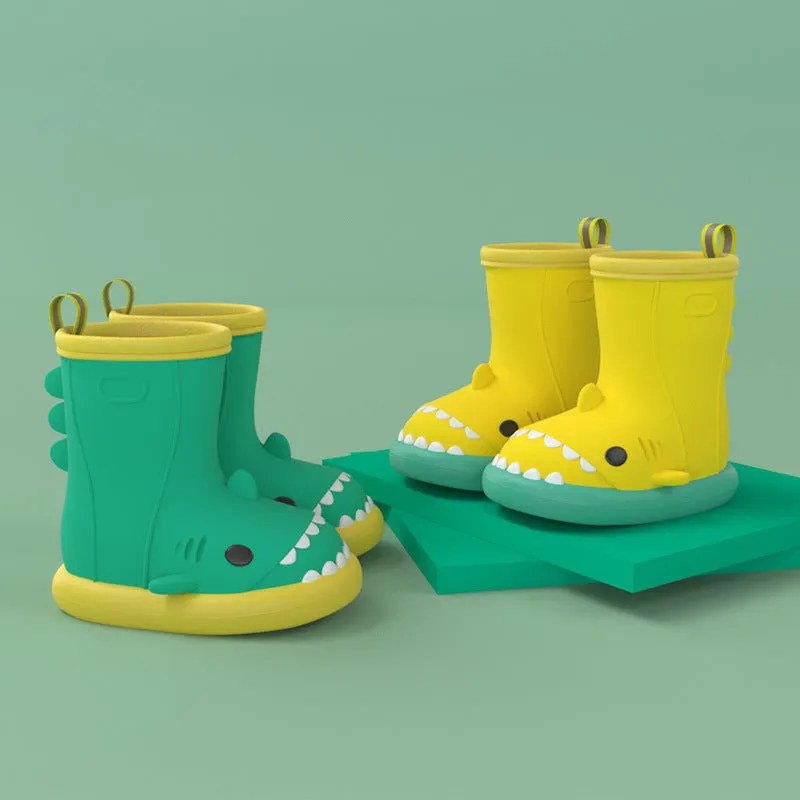 Shark and dinosaur design children's rain boots in green, available in multiple colours and sizes.