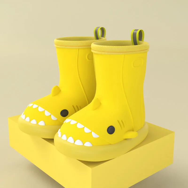 Shark and dinosaur design children's rain boots in green, available in multiple colours and sizes.