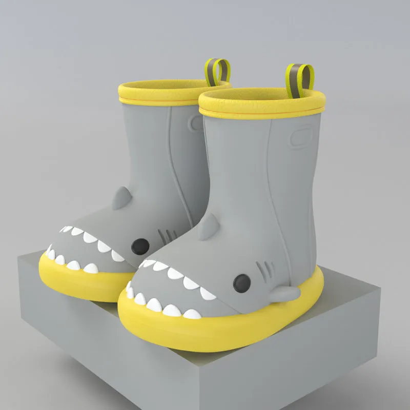 Shark and dinosaur design children's rain boots in green, available in multiple colours and sizes.