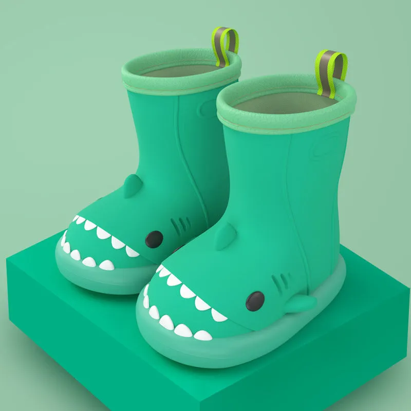 Shark and dinosaur design children's rain boots in green, available in multiple colours and sizes.