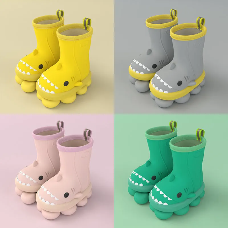 Shark and dinosaur design children's rain boots in green, available in multiple colours and sizes.