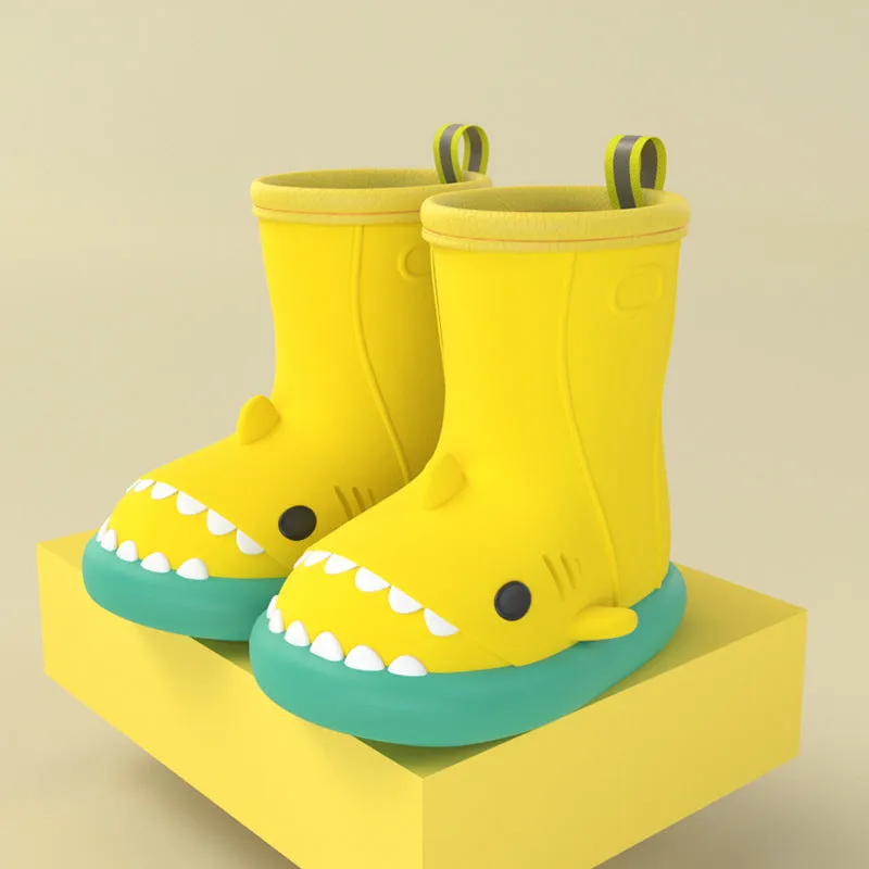 Shark and dinosaur design children's rain boots in green, available in multiple colours and sizes.