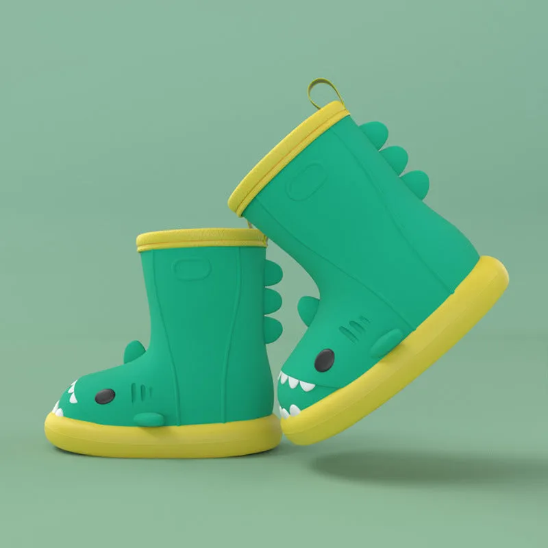 Shark and dinosaur design children's rain boots in green, available in multiple colours and sizes.