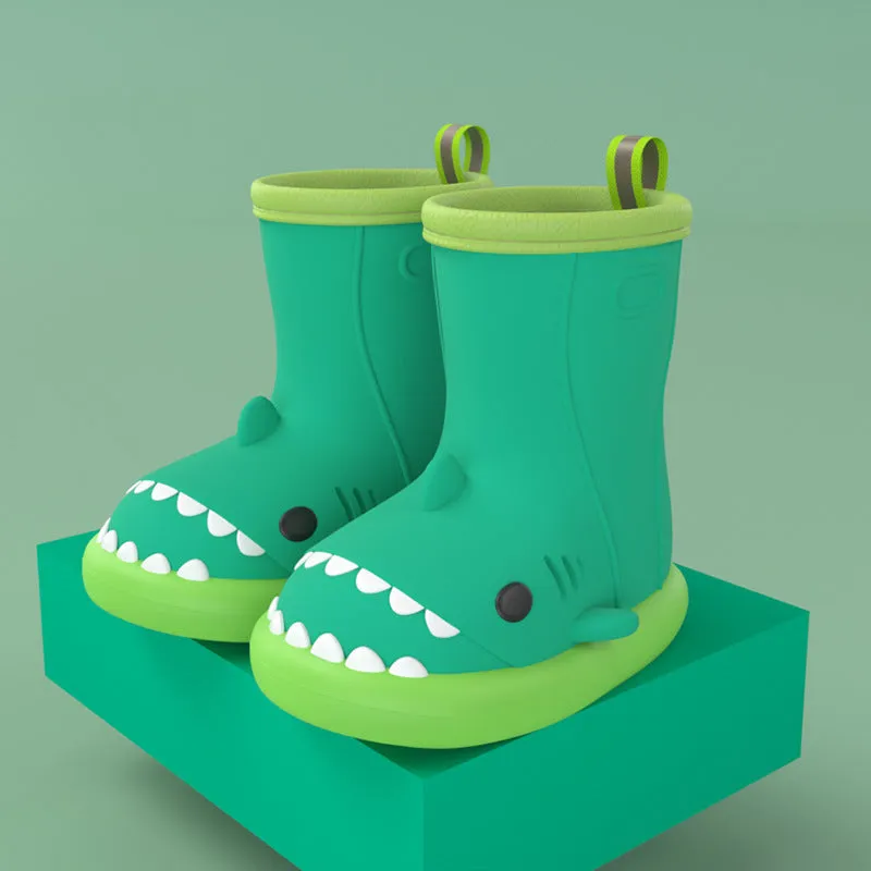 Shark and dinosaur design children's rain boots in green, available in multiple colours and sizes.