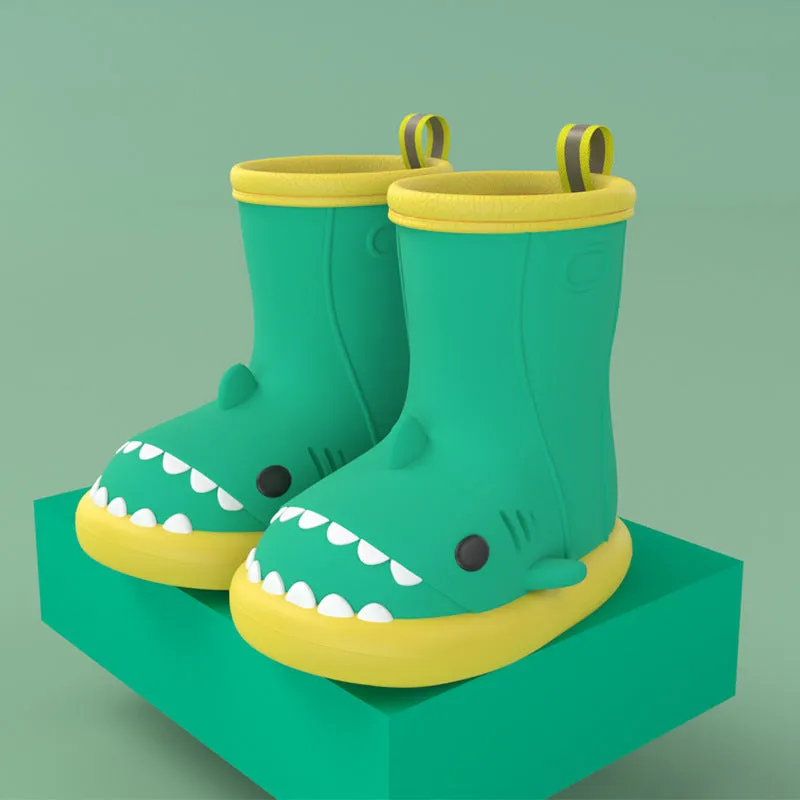 Shark and dinosaur design children's rain boots in green, available in multiple colours and sizes.