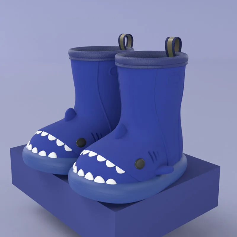 Shark and dinosaur design children's rain boots in green, available in multiple colours and sizes.