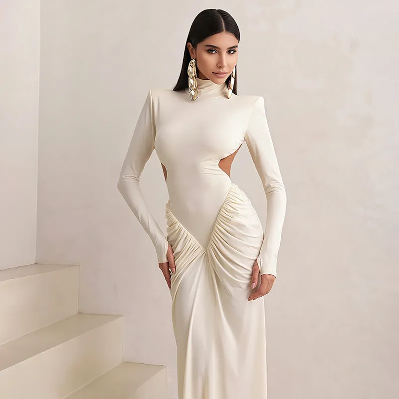 Women's slim fit long sleeve dress with high collar and pleated backless detail in apricot colour.