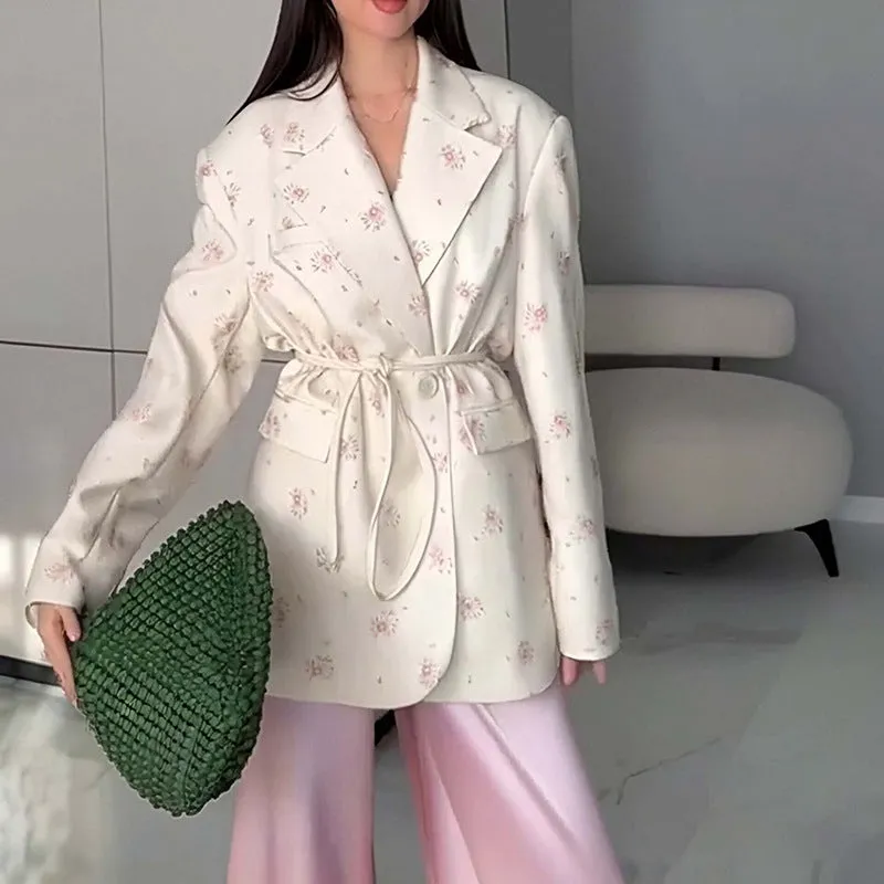 Polyester suit jacket with an adjustable lace-up collar at the waist, shown in a floral print colour option.